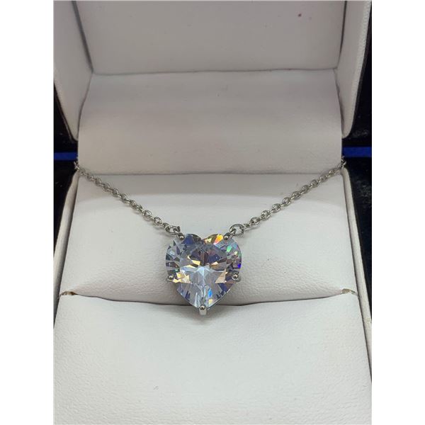 Heart Shaped Necklace with a Subtle Bule Gemstone.