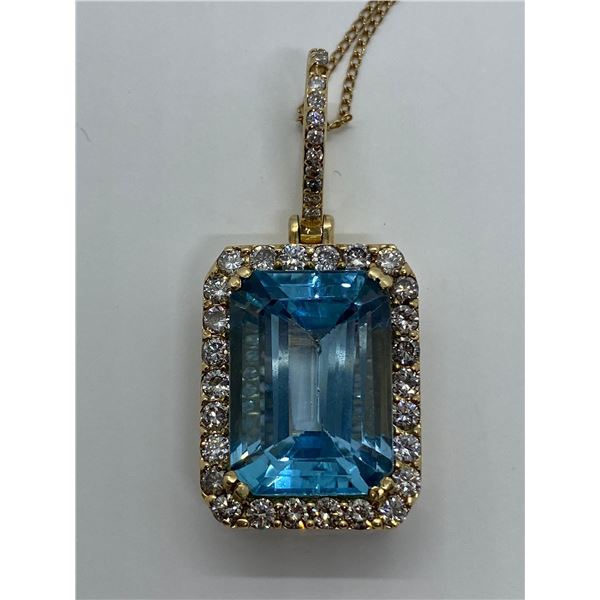 14K Gold Emerald cut blue Topaz and Diamond Pendant - value $7,980