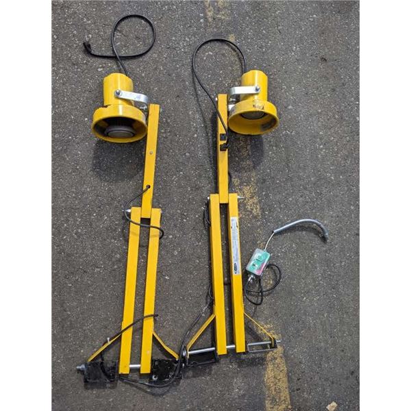 A pair of Fostoria use yellow loading dock lights