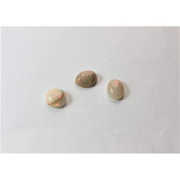 23)  LOT OF 3 NATURAL OVAL ETHIOPEAN FIRE OPAL GEMSTONES, TOTAL OF 3 CARETS,  READY FOR SETTING.  JE