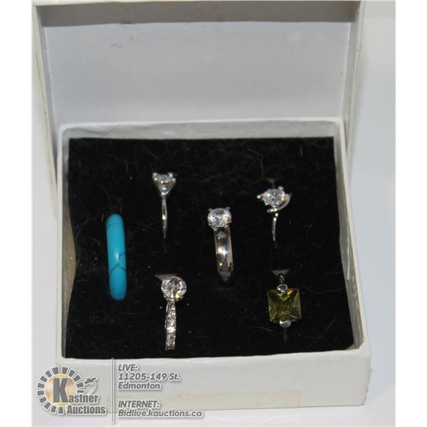 BOX OF VARIOUS FASHION RINGS 6 DIFFERENT RINGS, MOST HAVE CRYSTAL OR OTHER GEMS