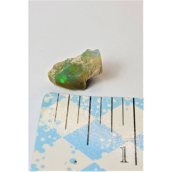 16)  NATURAL ETHIOPEAN ROUGH FIRE OPAL GEMSTONE, WEIGHING 5.0 CARETS.
