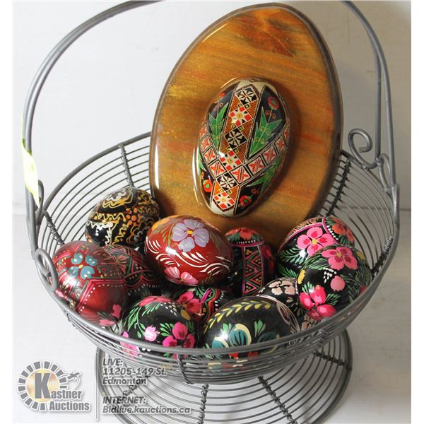 EASTER EGG LOT A DOZEN HANDPAINTED WOODEN EASTER EGGS AND A MOUNTED GOOSE EGG.      HOUSEHOLD.