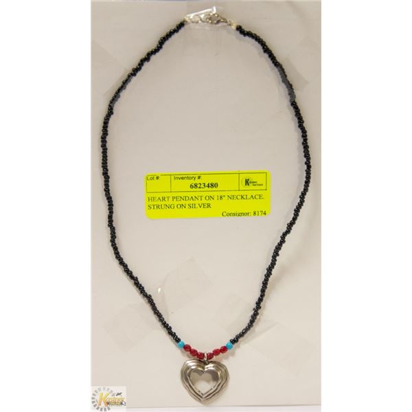 HEART PENDANT ON 18" NECKLACE. STRUNG ON SILVER