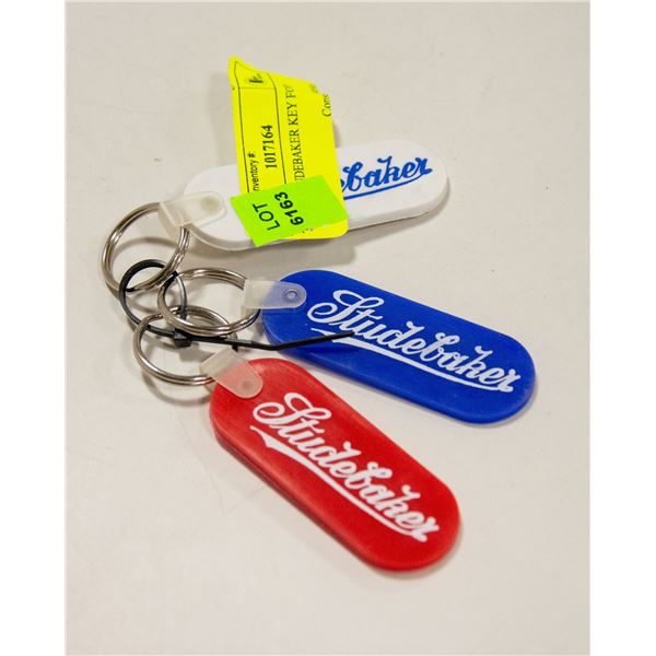 THREE STUDEBAKER KEY FOBS