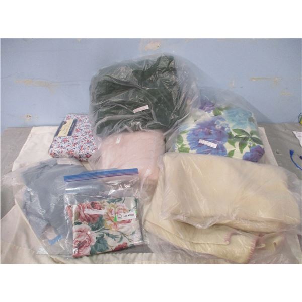 Large Assortment of Bed Sheets and Quilts