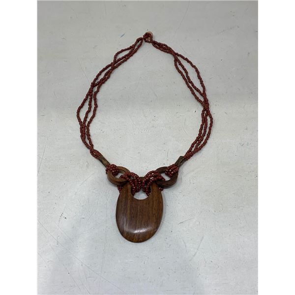 Beaded necklace with wooden pendant