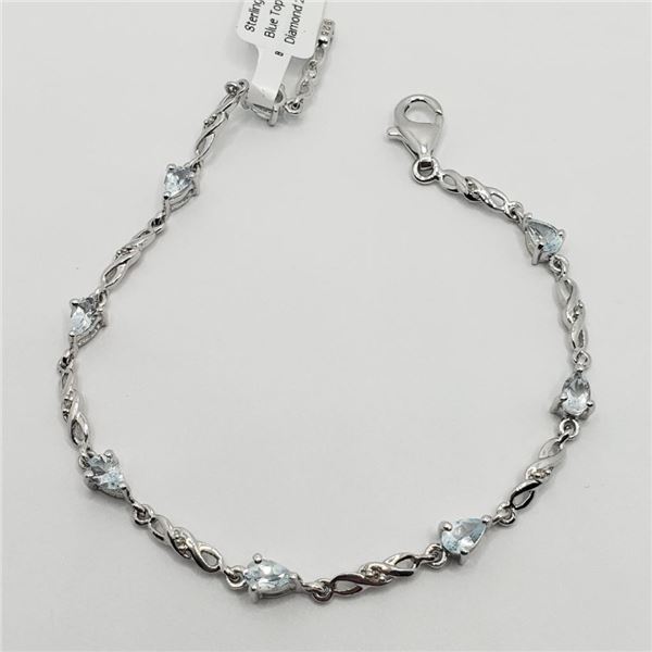 Silver Blue Topaz And Small Diamond 7"(2ct) Bracelet (~weight 4.75g), Suggested Retail Value $200