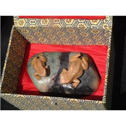 Stone carving in shape of 2 frogs resting on a #1844720