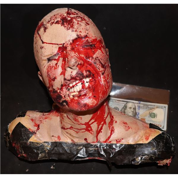 SEVERED BLOODY FEMALE HEAD WITH TEETH