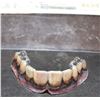 Image 1 : DAWN OF THE DEAD ZOMBIE TEETH SCREEN USED