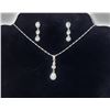Image 1 : 12)  SILVER TONE ANDCLEAR RHINESTONE PENDANT ON 20" BAR AND BEAD CHAIN AND MATCHING DROP EARRINGS ON