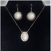 Image 1 : 15)  BRONZE TONE WITH WHITE OPALINE AND CLEAR CRYSTAL PENDANT ON 20" CHAIN AND MATCHING DROP EARRING