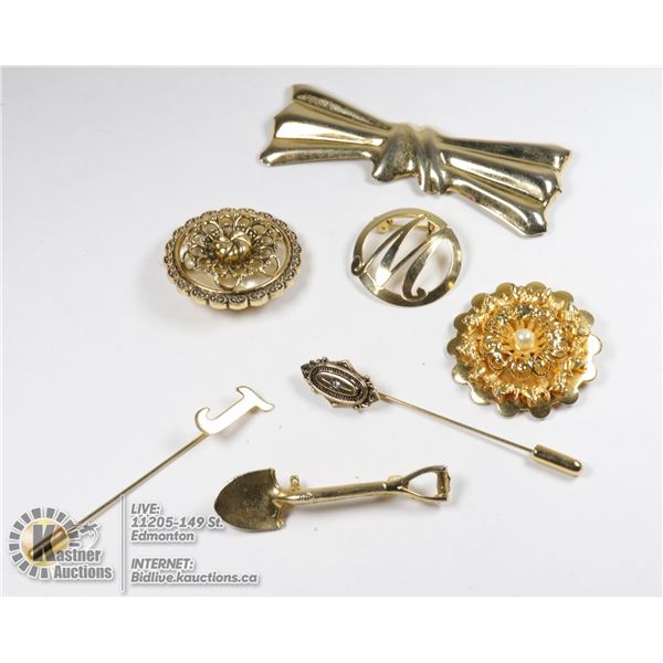 BOX OF ANTIQUE BROOCHES, DRESS CLIPS, AND NECK CUFF PINS