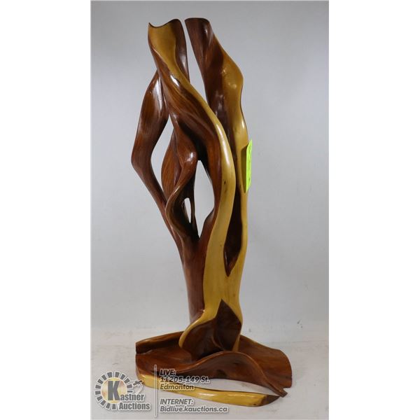 TALL WOOD STATUE VARIOUS COLORS OF WOOD, STANDS 21 INCHES TALL