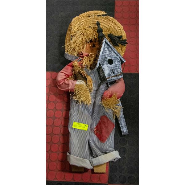 YARD DOLL WITH BIRD HOUSE