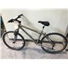 Image 1 : GREY NORCO 24 SPEED FRONT SUSPENSION MOUNTAIN BIKE WITH NO PEDALS AND FLAT BACK TIRE