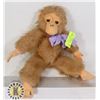 Image 1 : STUFFED BROWN MONKEY WITH PURPLE RIBBON ON NECK
