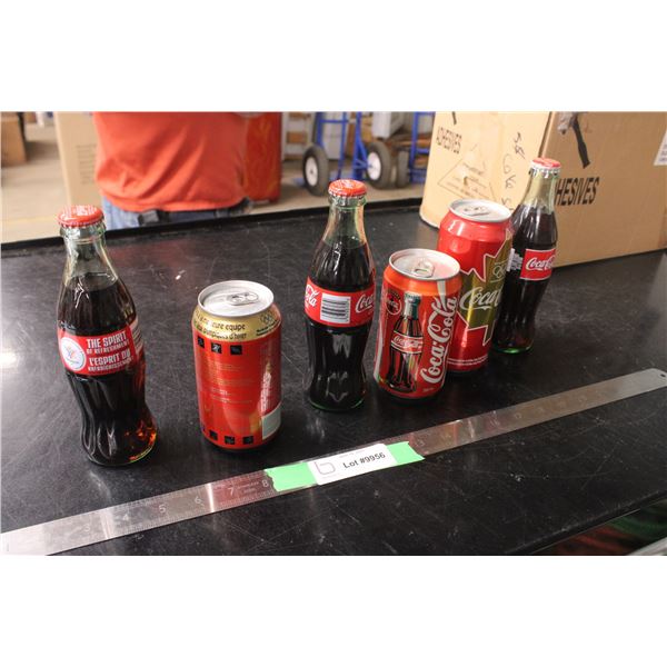 Lot of Coca Cola Bottles and Cans