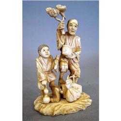 CARVED ASIAN GROUPING OF MAN and boy with 