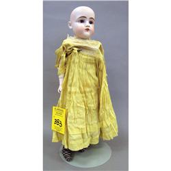 BISQUE HEAD DOLL with brown eyes, leather 