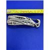 Image 1 : Leatherman Skeletool Folding Pocket Knife with Clip.