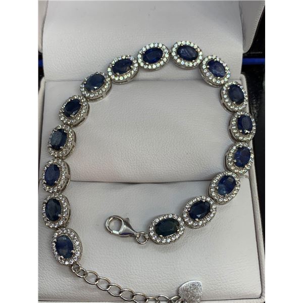 Blue stoned oval cut bracelet (10.15ct) ~Estimated retail value $1,900 -with certificate