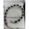 Image 1 : Blue stoned oval cut bracelet (10.15ct) ~Estimated retail value $1,900 -with certificate