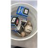 Image 3 : Bucket of base balls and new softballs