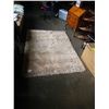 Image 1 : 5 foot by 7 foot cream shag area rug
