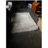 Image 1 : 5 foot by 7 foot white shag rug