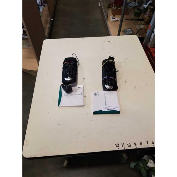 2 Logitech Harmony One remotes with charging docks