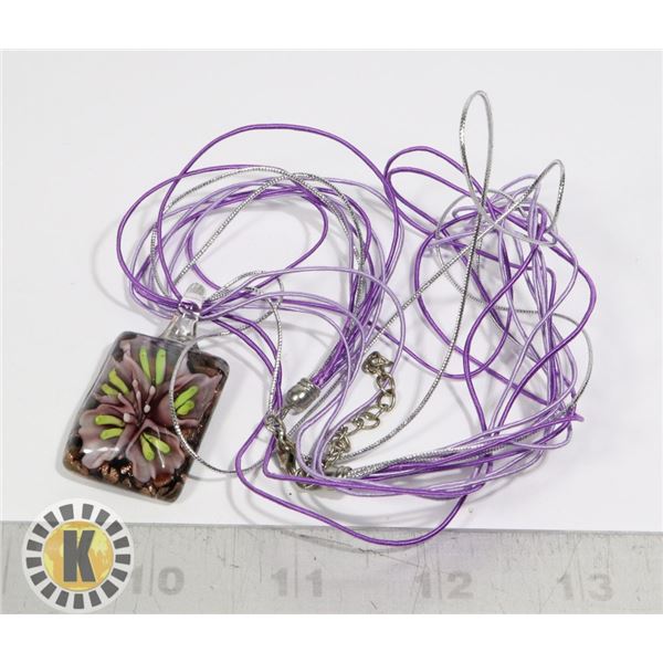GLASS FLOWER IN GLASS PURPLE WITH A PURPLE ROPE