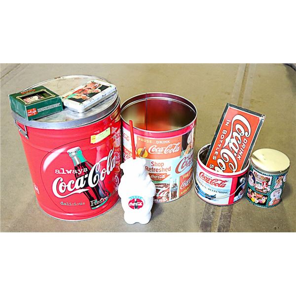 2 LARGE COKE  TINS WITH ASSORTED COKE ITEMS