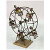 Image 3 : A SCULPTURAL METAL FERRIS WHEEL AND RIDERS