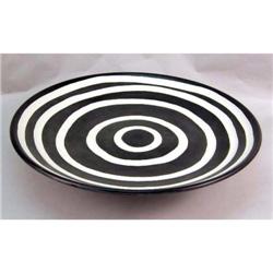 AN EXTREMELY LARGE THROWN-CLAY BROWN-AND-CREAM FOOTED SERVING PLATTER