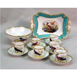 SIX EXOTIC-BIRD DECORATED CUPS AND SAUCERS