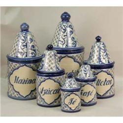 A SIX PIECE BLUE-AND-CREAM KITCHEN CANISTER SET