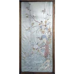 A FRAMED NEEDLEWORK ON SILK