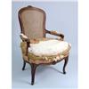 Image 1 : A CANE-BACKED AND UPHOLSTERED ARMCHAIR