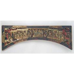 A POLYCHROME AND GILT- DECORATED WOODCARVING