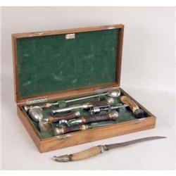 A BOXED SET OF STERLING SILVER MOUNTED HORN-LIKE BAR ITEMS