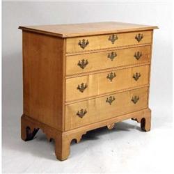 A CHIPPENDALE CARVED MAPLE CHEST OF DRAWERS