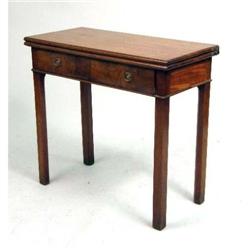 A GEORGE II FIGURED MAHOGANY GAMES TABLE