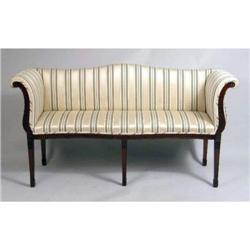 A GEORGE III CARVED MAHOGANY SERPENTINE FRONT CAMELBACK SETTEE