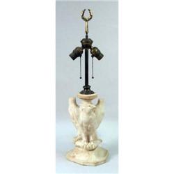 A CARVED STONE BIRD FIGURAL TABLE LAMP
