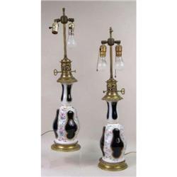 A PAIR OF PORCELAIN POLYCHROME AND PARCEL-GILT DECORATED URNS