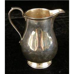 A TIFFANY & CO MAKERS STERLING SILVER FOOTED CREAM JUG