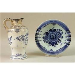 A BLUE AND WHITE DELFT JUG