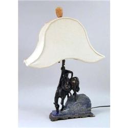 A PATINATED METAL SCULPTURE